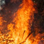 More than a dozen uncontained wildfires continue to burn in the West