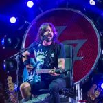 Metal musician shot in leg defending others from alleged gunman plays concert from Dave Grohl’s throne